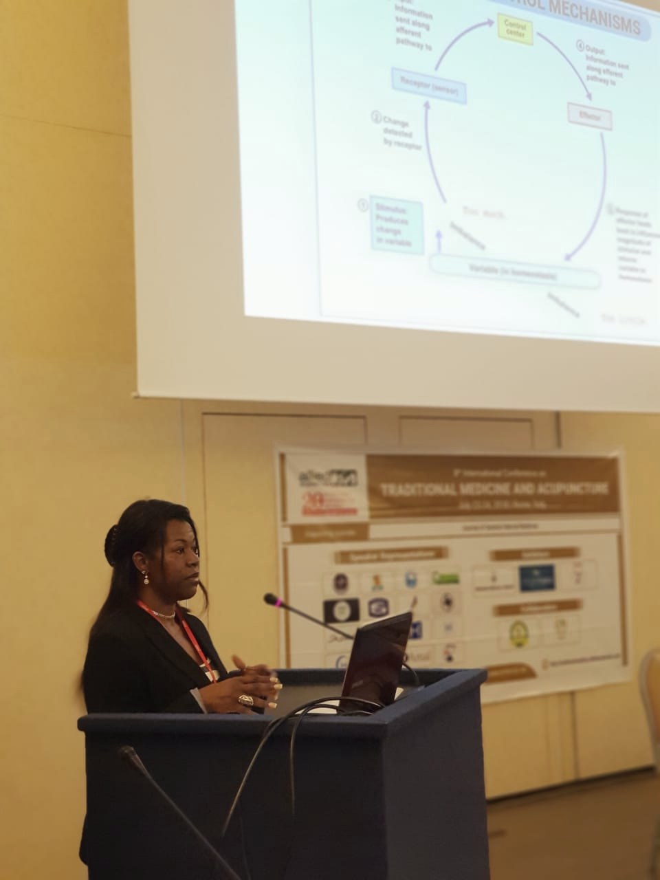 Dr. Lakisha presenting on the endocannabinoid system, Rome