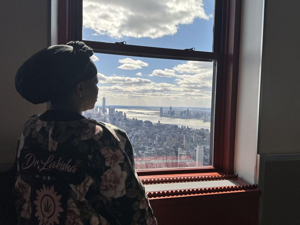 Dr. Lakisha overlooking the New York City skyline
