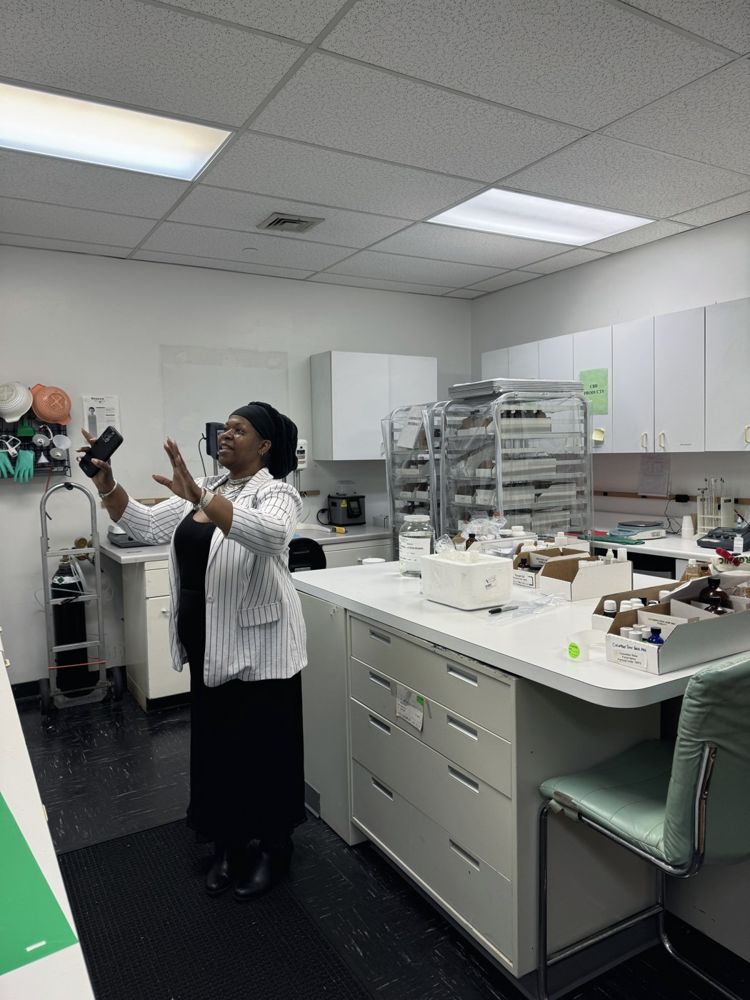 Dr. Lakisha in a botanical laboratory