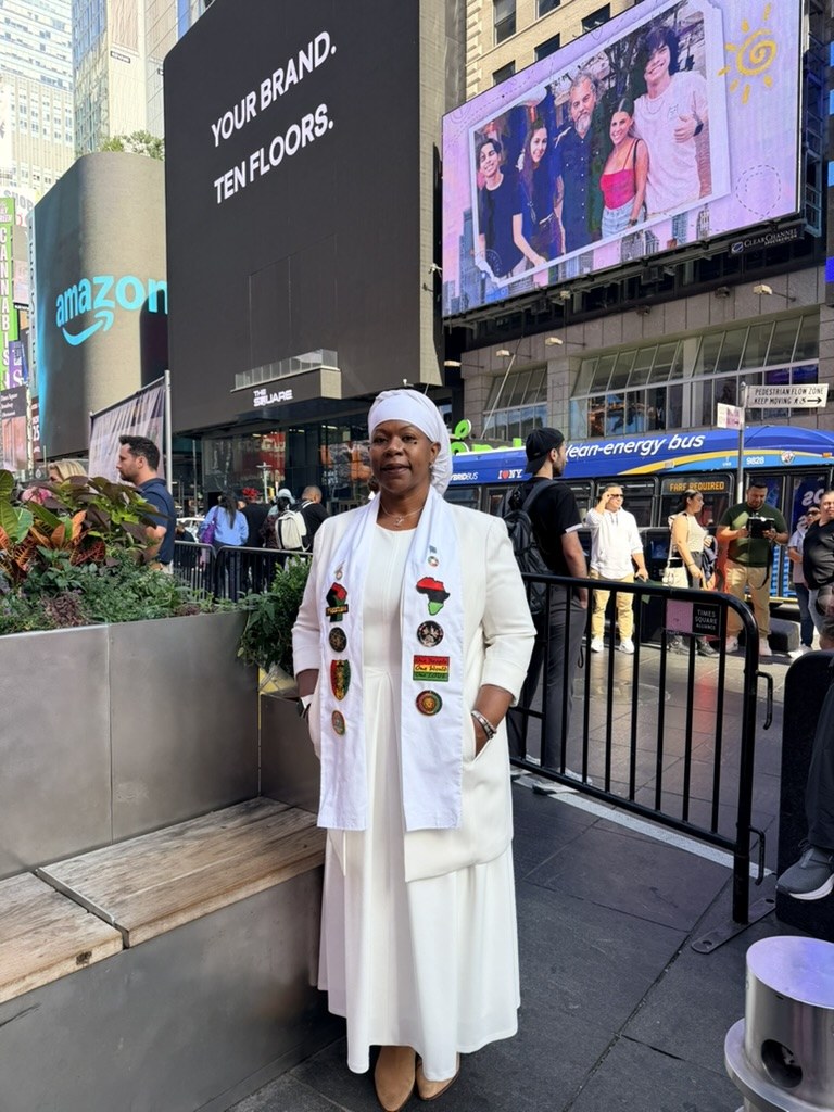 Dr. Lakisha standing in Times Square, New York City