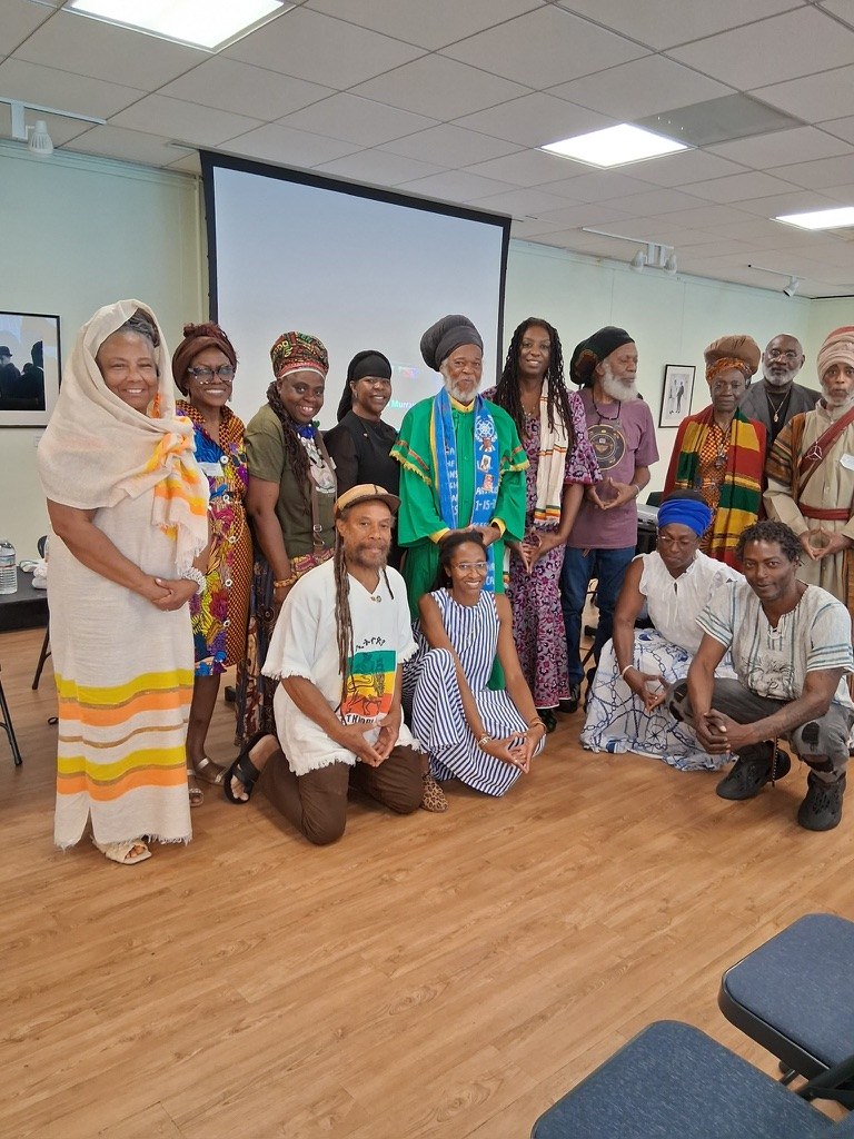 Larger group including Dr. Lakisha and Hon. Priest Eueston Bailey at the Ethiopian World Federation convention