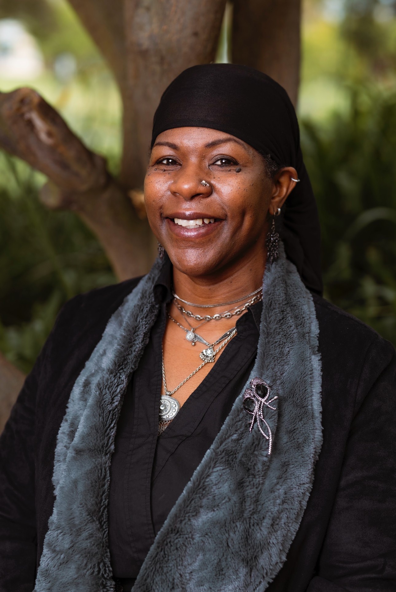 Dr. Lakisha Jenkins-Samuels, smiling in a garden